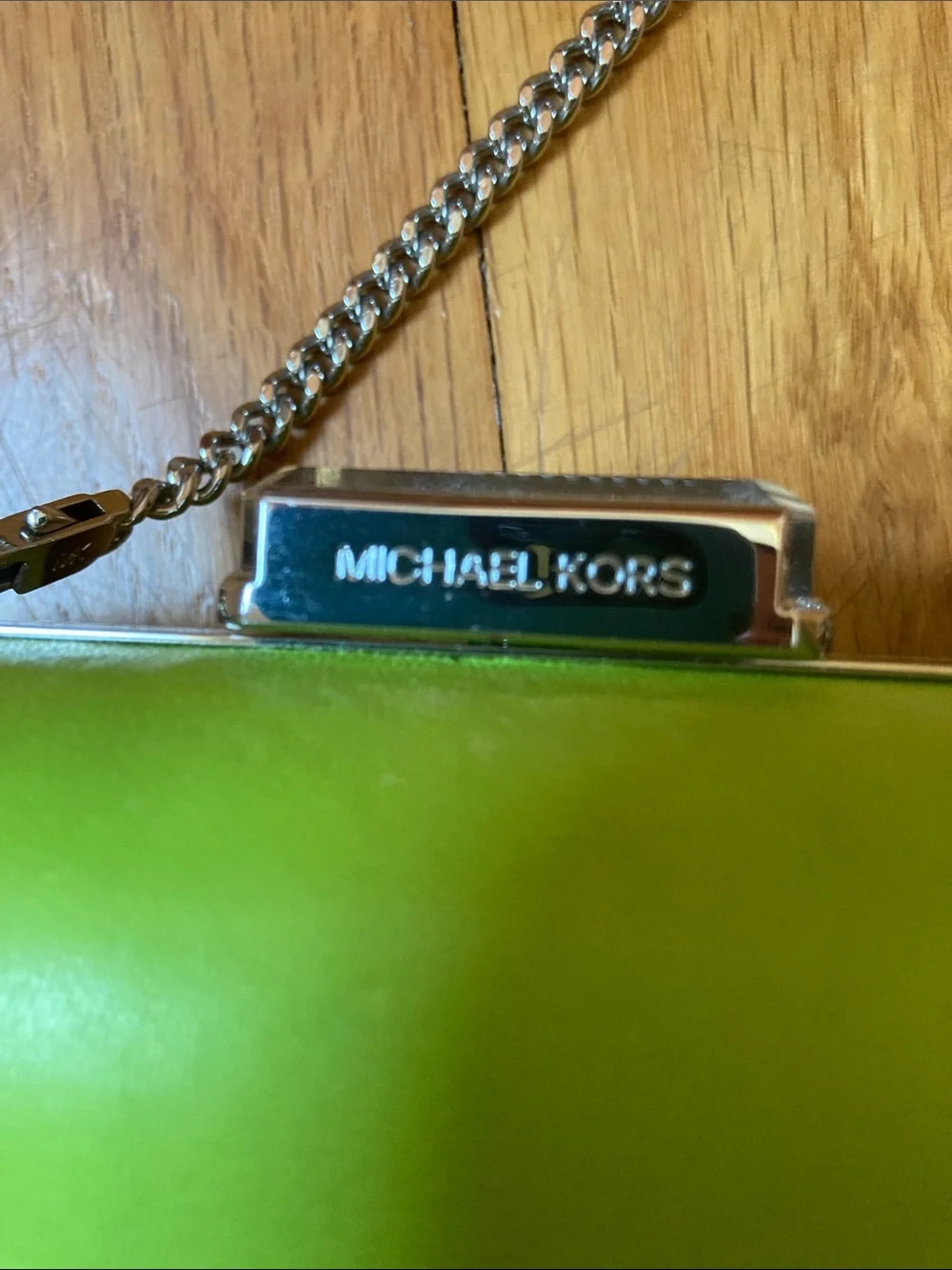 Michael Kors Lime Green Chain Strap Clutch with white bag protector